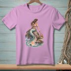 Lavender t-shirt with watercolor graphic of a mermaid sitting on rocks holding a crab and a sign.