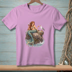 Mermaid with red hair sits on a rock, holding a wine glass, feeding a seagull.