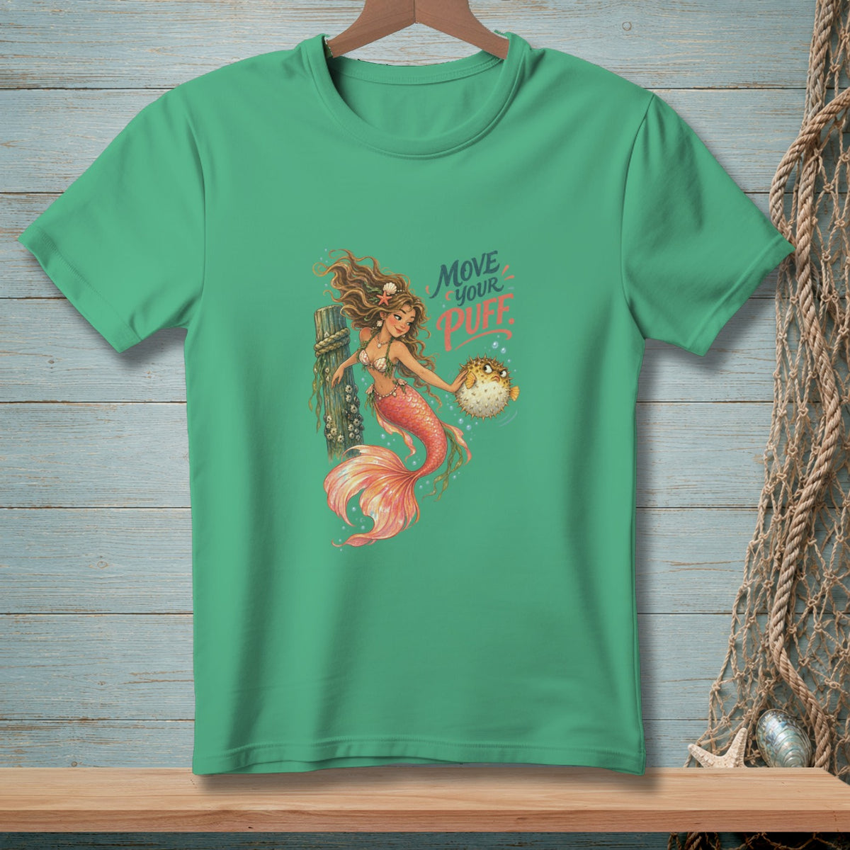 Mermaid holding pufferfish with text "MOVE YOUR PUFF" on a green t-shirt.