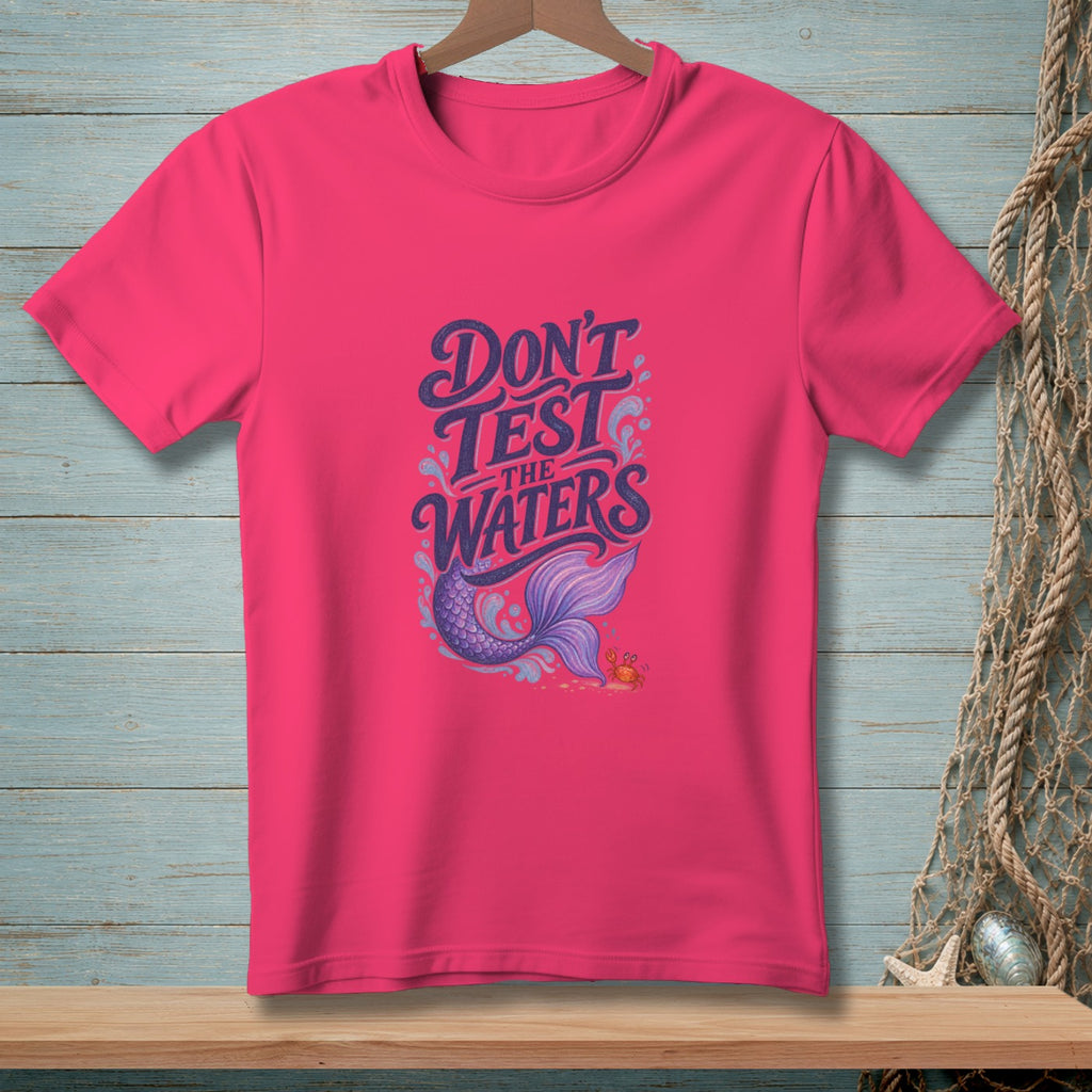 Pink t-shirt with "Don't Test The Waters" text, mermaid tail, and crab graphic.