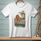 White t-shirt with a mermaid on a dock, text reads "Whatever Floats Your Boat."