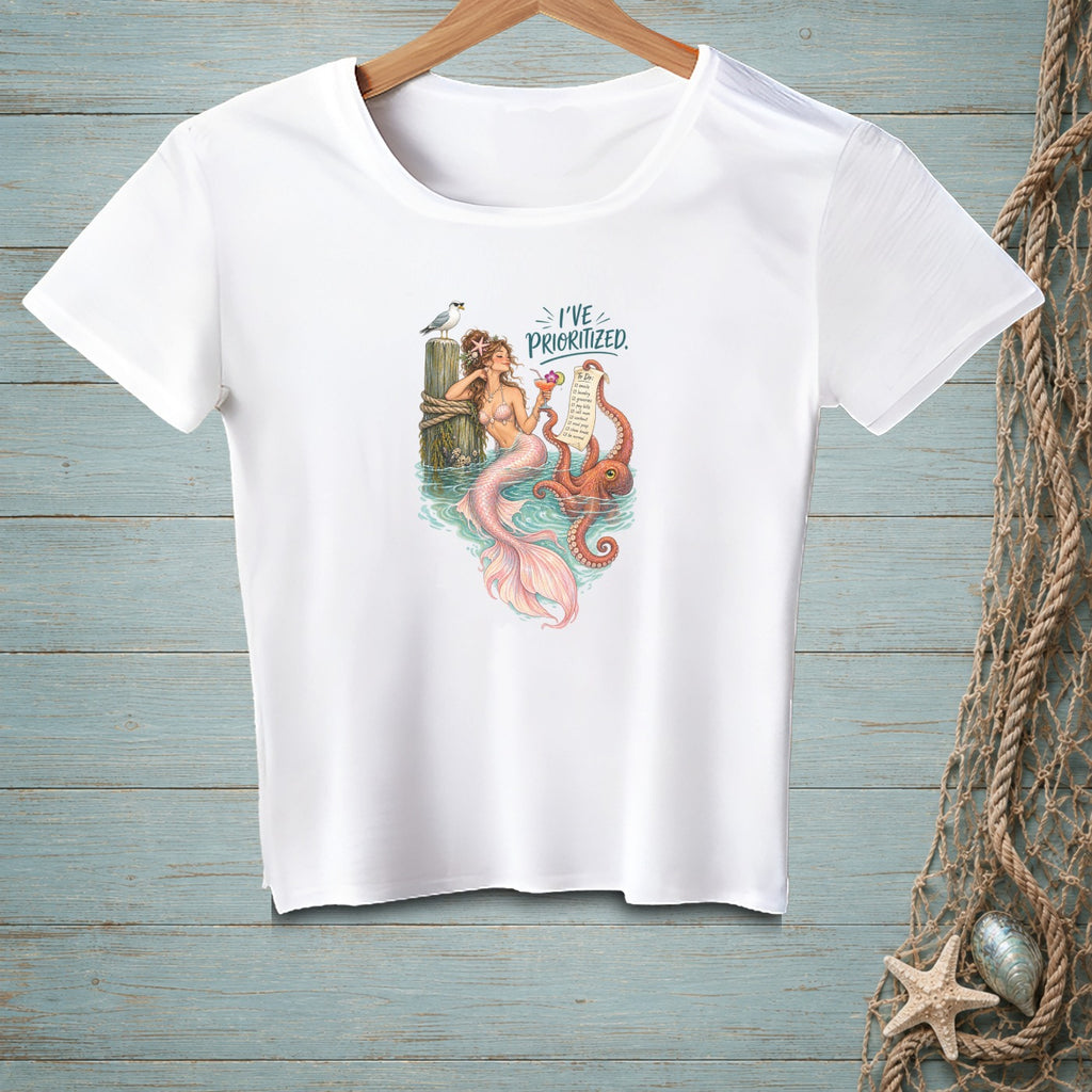 White t-shirt with mermaid, octopus, and text "I've Prioritized."