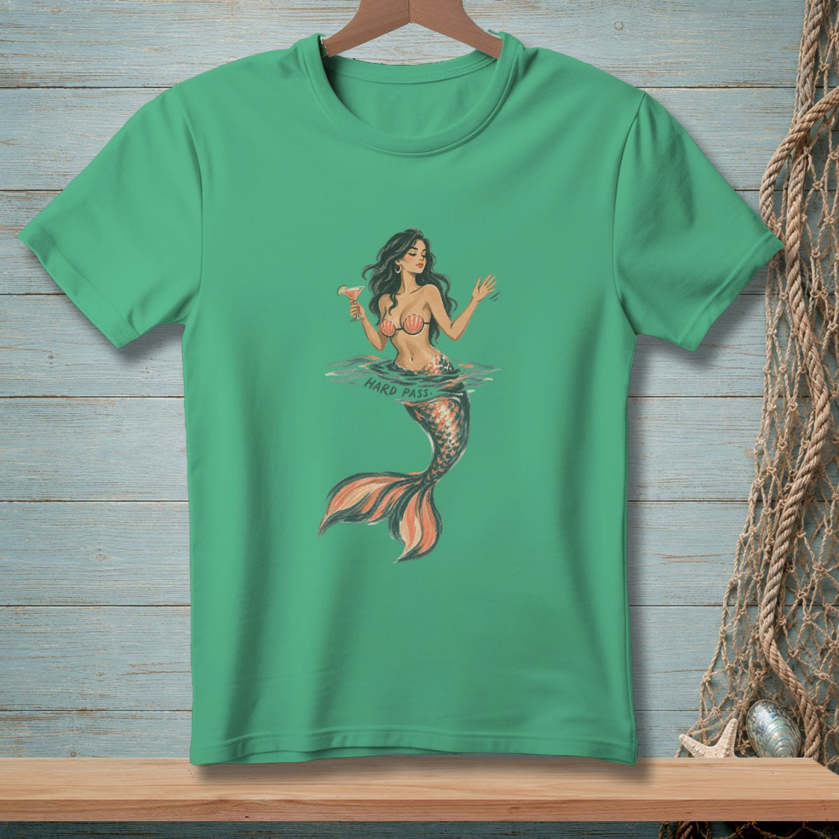 Green t-shirt with illustration of a mermaid holding a drink with text "HARD PASS".