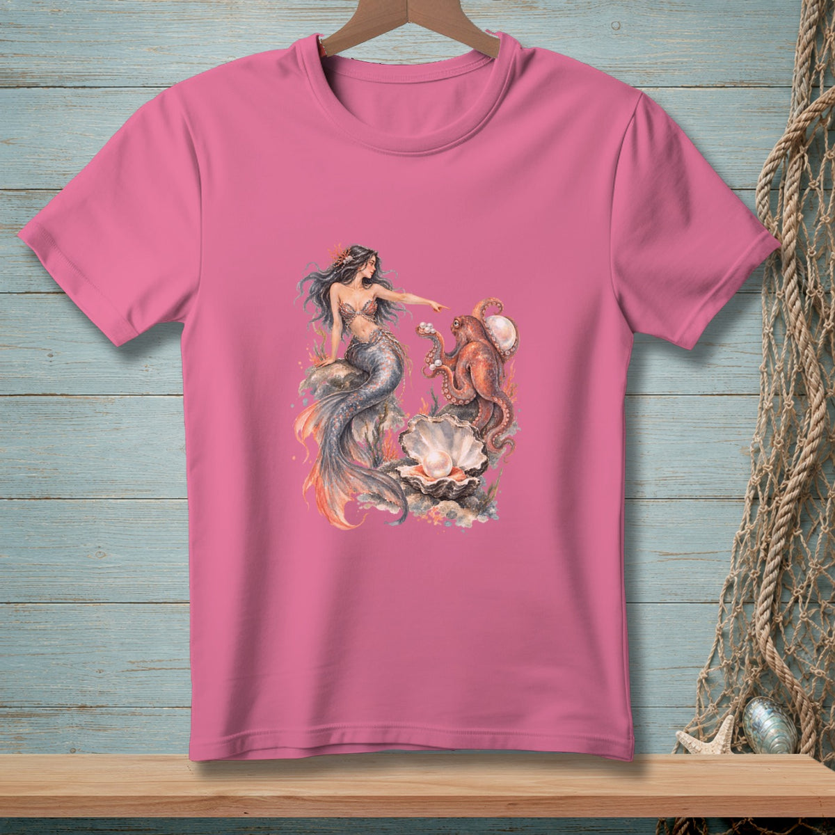 Pink t-shirt with watercolor art of a mermaid, octopus, and pearl.