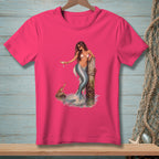 Pink t-shirt with a mermaid holding a drink by a wooden post.