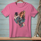 Pink t-shirt with graphic of a mermaid by a boat, holding a bottle.