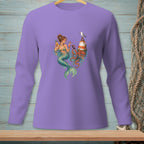 Mermaid with drinks near lighthouse and octopus on purple long sleeve shirt.