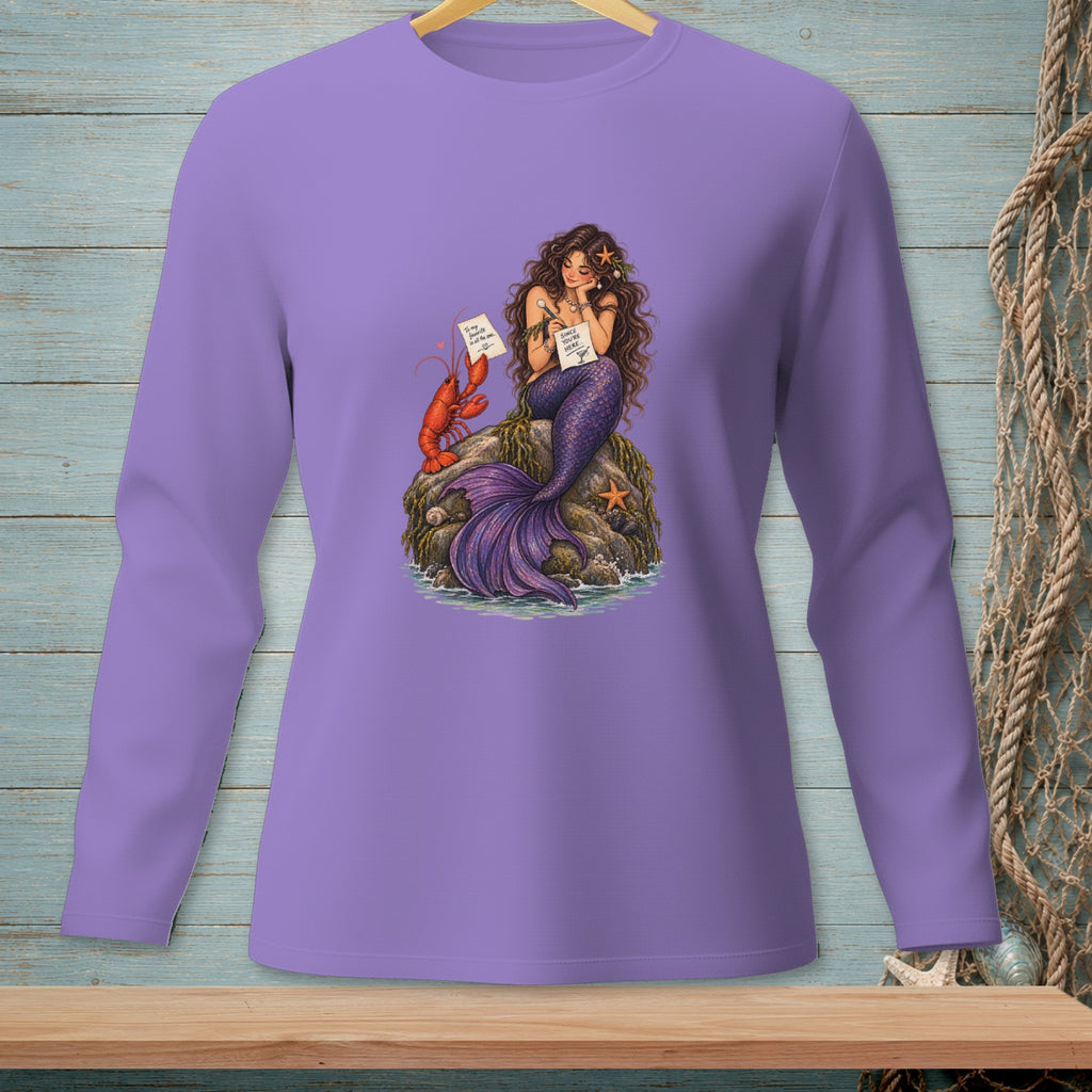 Mermaid with lobster and starfish on a rock holding notes, on a purple shirt.
