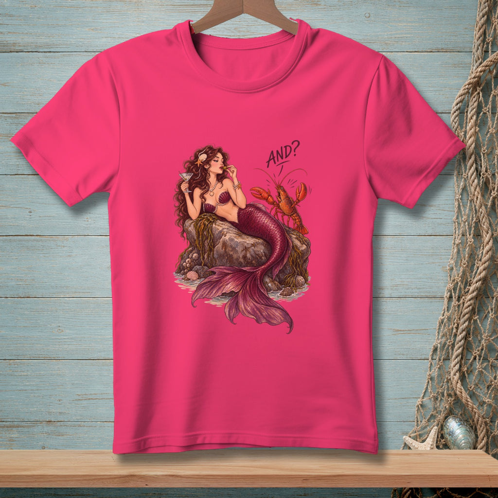 Pink t-shirt with illustration of a mermaid and lobster and text "AND?".