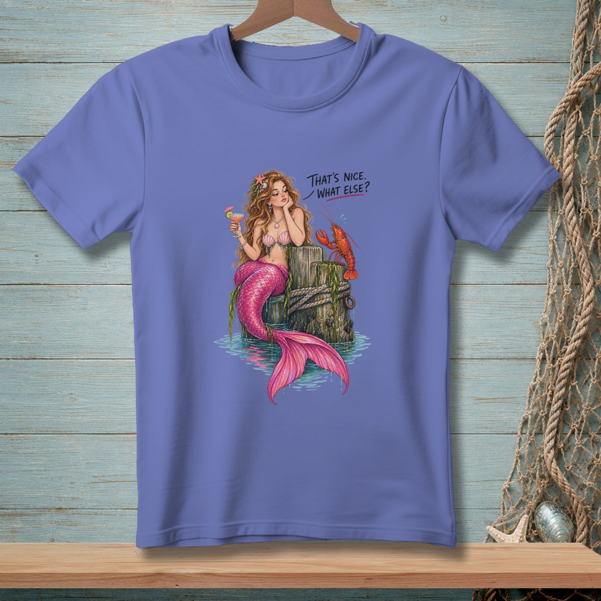 Mermaid with pink tail and cocktail with lobster, text "That's nice. What else?"