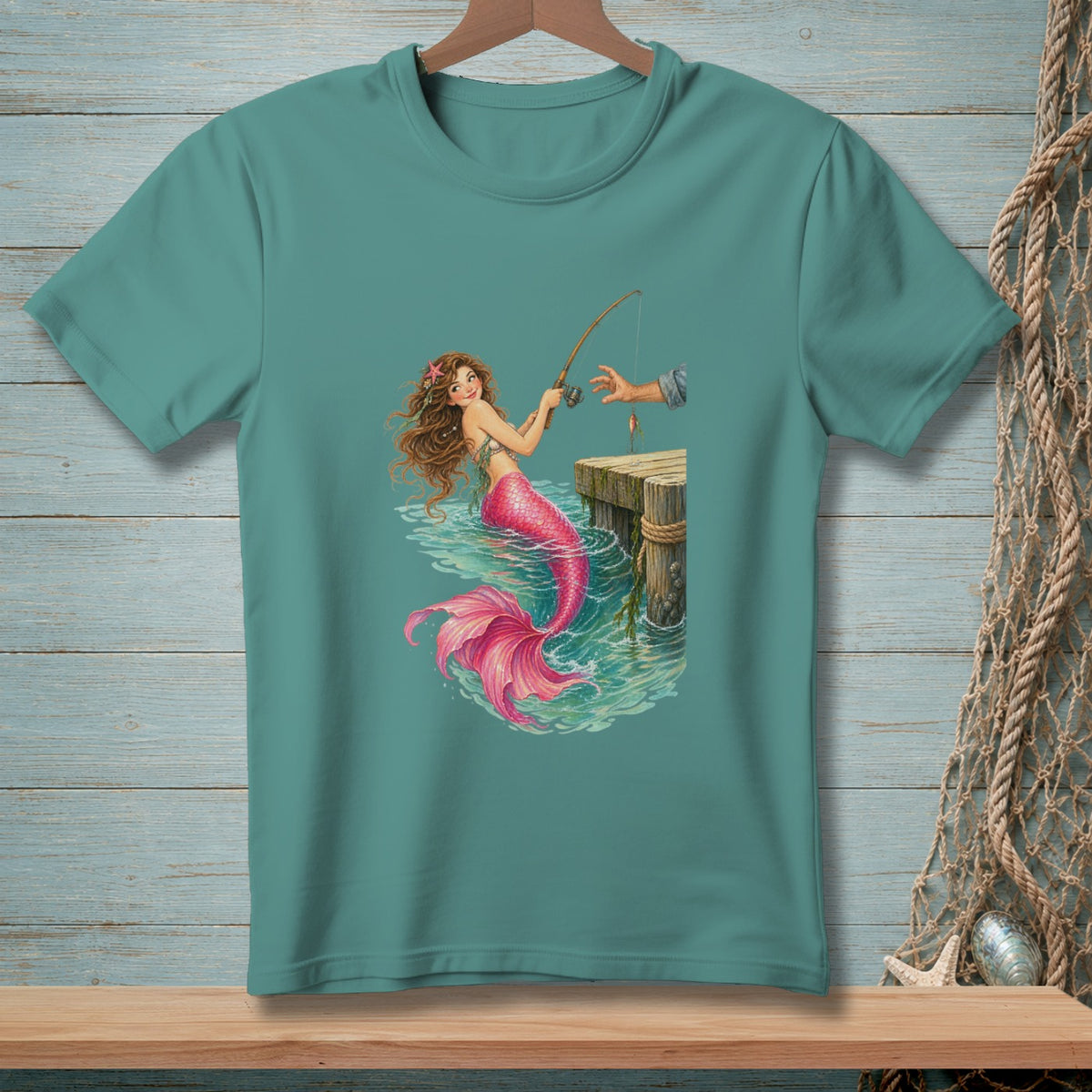 Illustration of a mermaid with a pink tail fishing from a wooden pier.