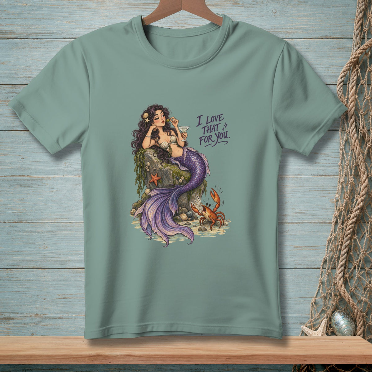 Teal t-shirt featuring a mermaid with purple tail, a crab, and text "I LOVE THAT FOR YOU."