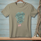Tan t-shirt with "Mermaid Hair Don't Care" text and mermaid tail graphic.