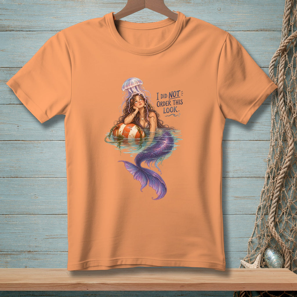 Mermaid with jellyfish hat on a buoy, text reads "I DID NOT ORDER THIS LOOK."
