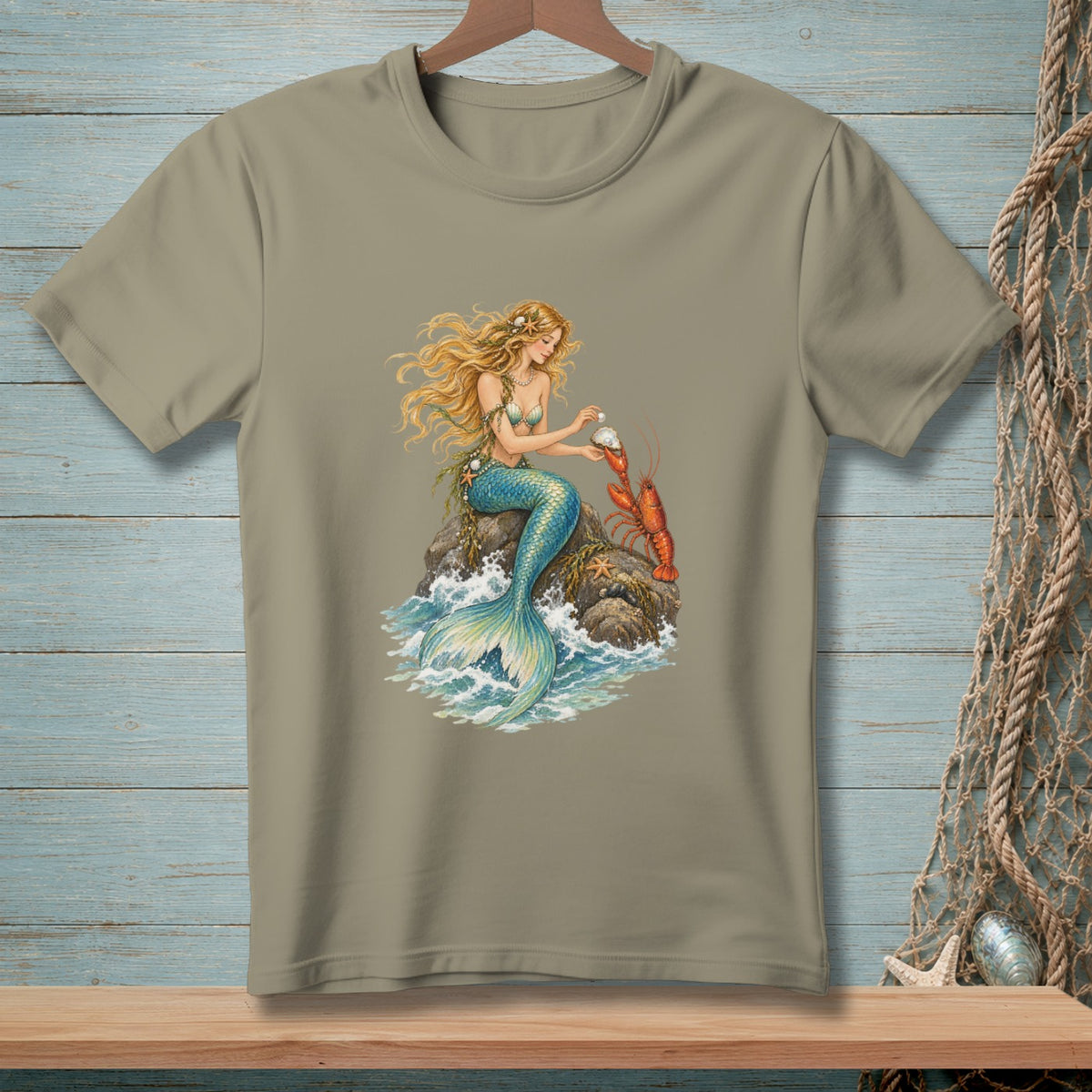 Blonde mermaid holding a pearl next to a lobster on a rock.