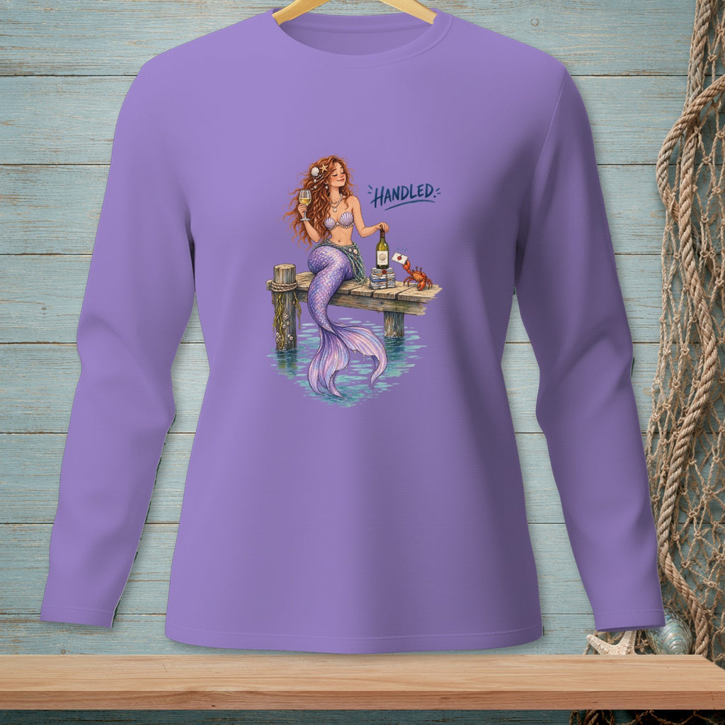 Mermaid with wine and crab on dock, text "Handled"