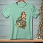 Mermaid resting on rocks with a treasure chest of pearls and shells.