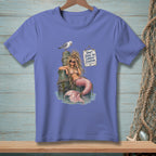 Purple t-shirt with a mermaid on a pier and text saying "Don't judge my current situation."