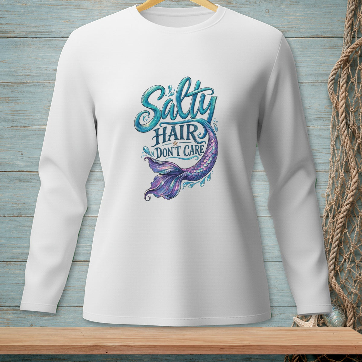 White long sleeve shirt with "Salty Hair Don't Care" text and a mermaid tail.