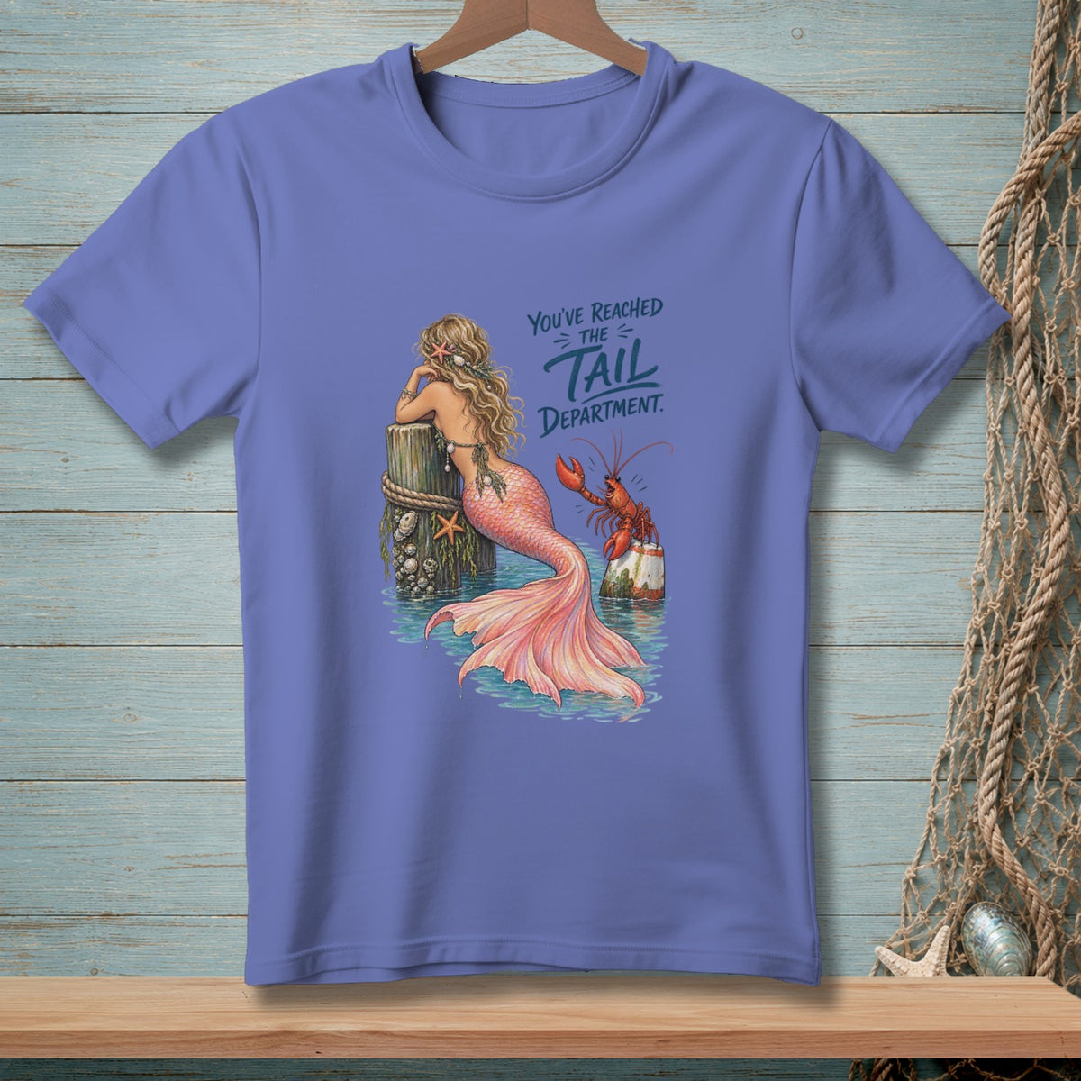 Mermaid leaning on post with crab, text reads "You've Reached The Tail Department".