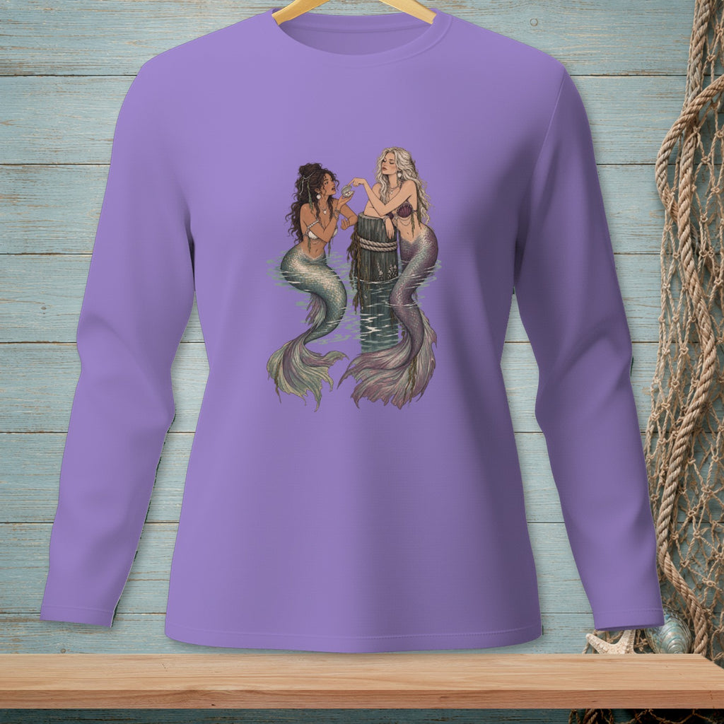 Purple long-sleeve shirt with an illustration of two mermaids on a wooden post.