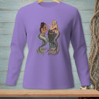 Purple long-sleeve shirt with an illustration of two mermaids on a wooden post.