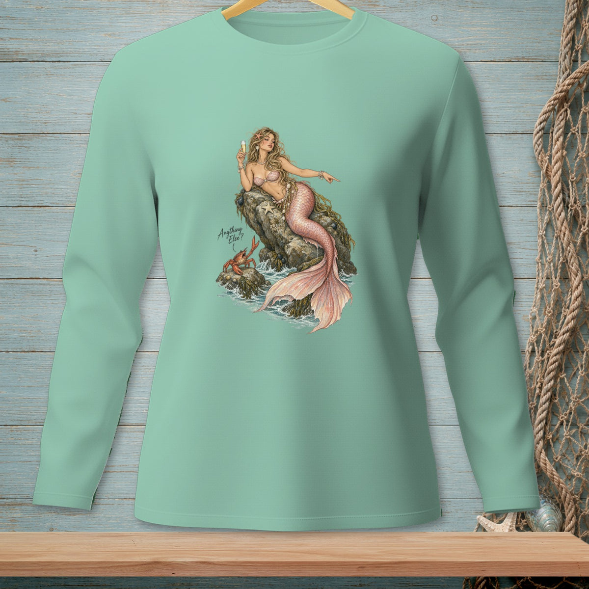 Mint green long-sleeve shirt with a mermaid, crab, and text "Anything Else?".