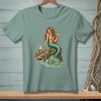 T-shirt with illustration of a mermaid holding a drink and a crab by the sea.