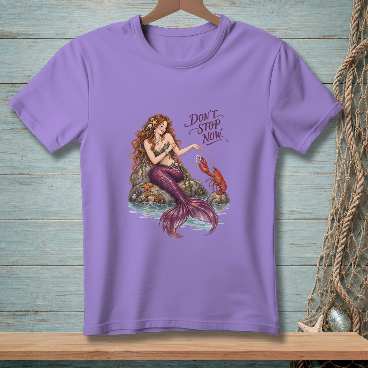 Mermaid with a lobster and text "Don't Stop Now" on a purple t-shirt.