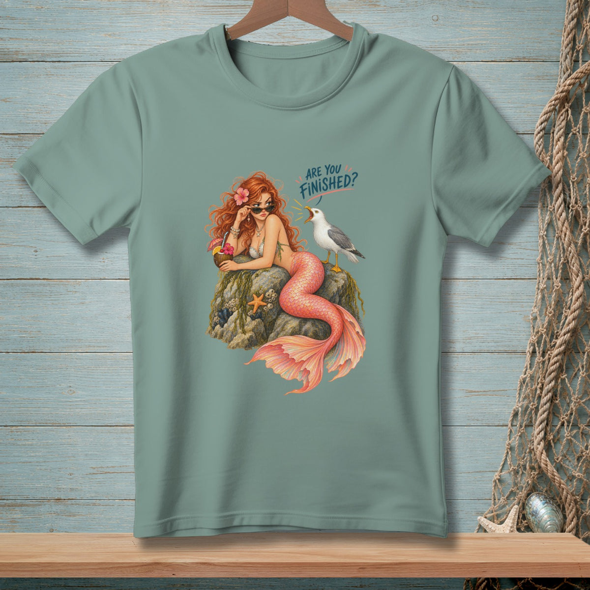 Mermaid with sunglasses and a cocktail, speaking to a seagull, with text "ARE YOU FINISHED?".