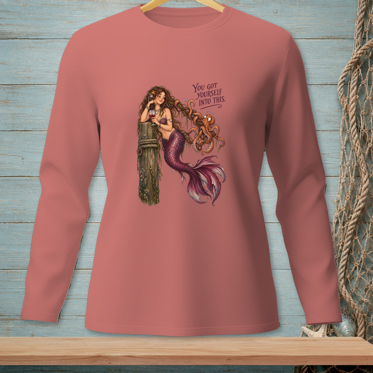 Mermaid with octopus and text "You got yourself into this" on pink long-sleeve shirt.