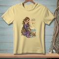Light yellow t-shirt with a mermaid pointing at a crab, saying "Scuttle along, sir."