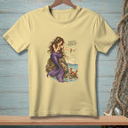 Light yellow t-shirt with a mermaid pointing at a crab, saying "Scuttle along, sir."