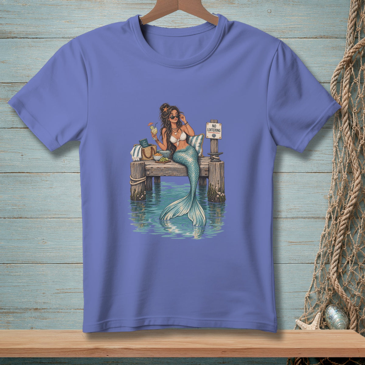 Mermaid on a dock with a drink and a "No Loitering" sign.
