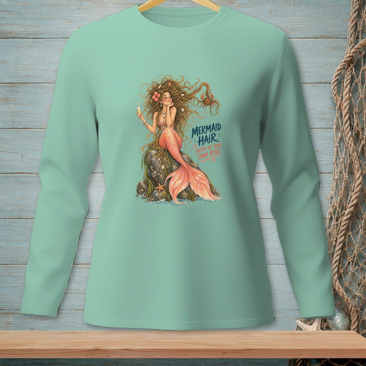 Long sleeve shirt featuring a mermaid graphic with text "Mermaid Hair. Enter at your own risk."