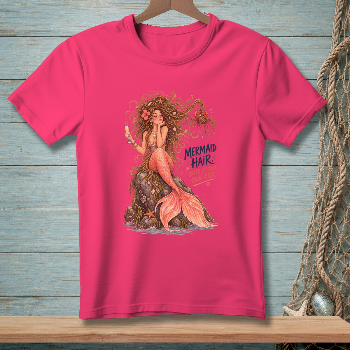 Pink t-shirt with mermaid illustration and text "Mermaid Hair. Enter At Your Own Risk."