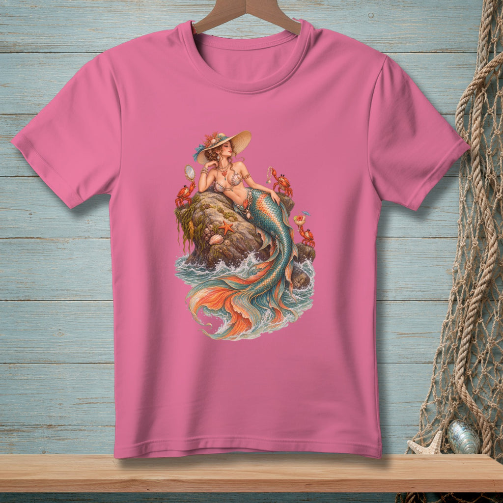 Pink t-shirt with a detailed illustration of a mermaid on a rock with crabs and starfish.