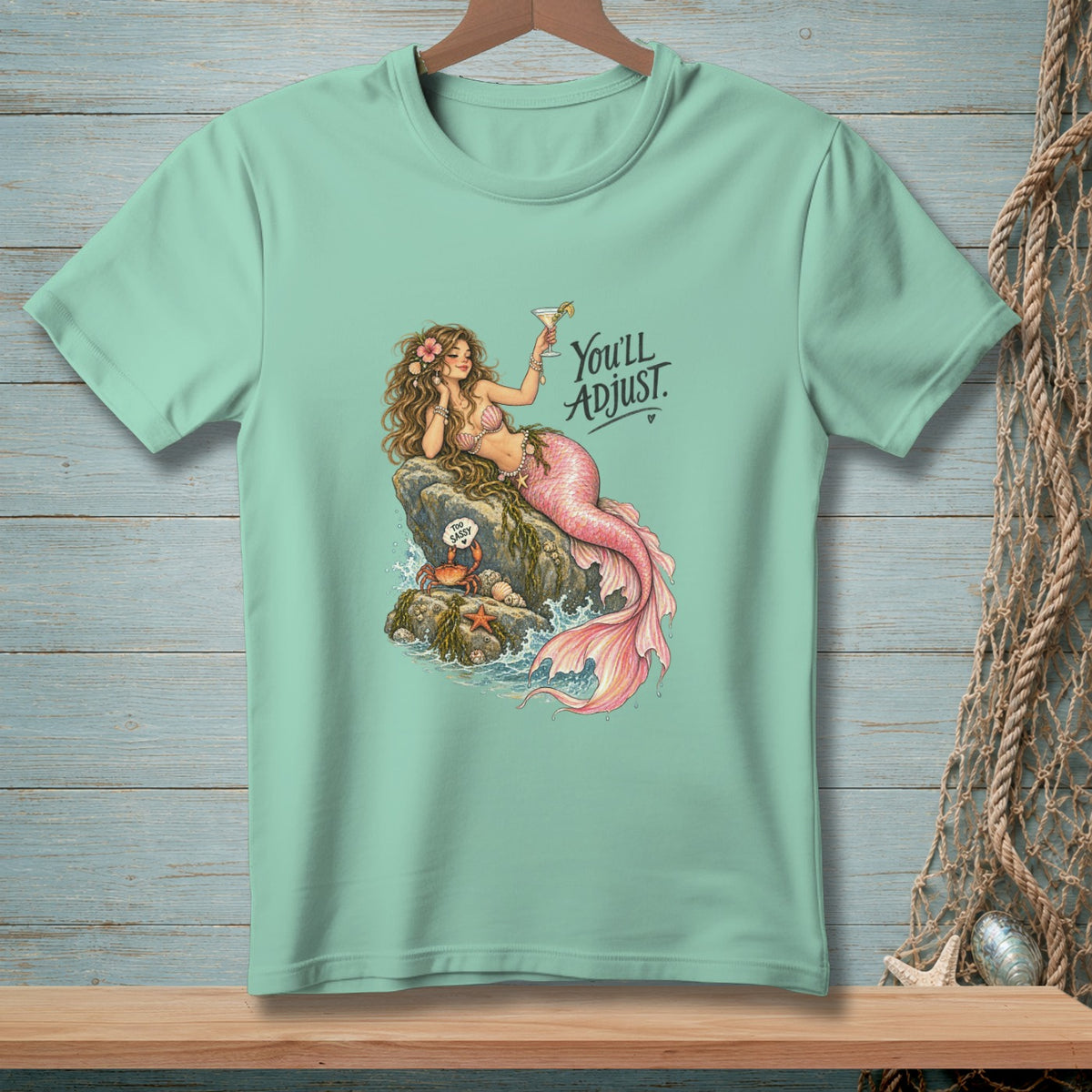 Mint t-shirt with a mermaid holding a martini and text "You'll Adjust."