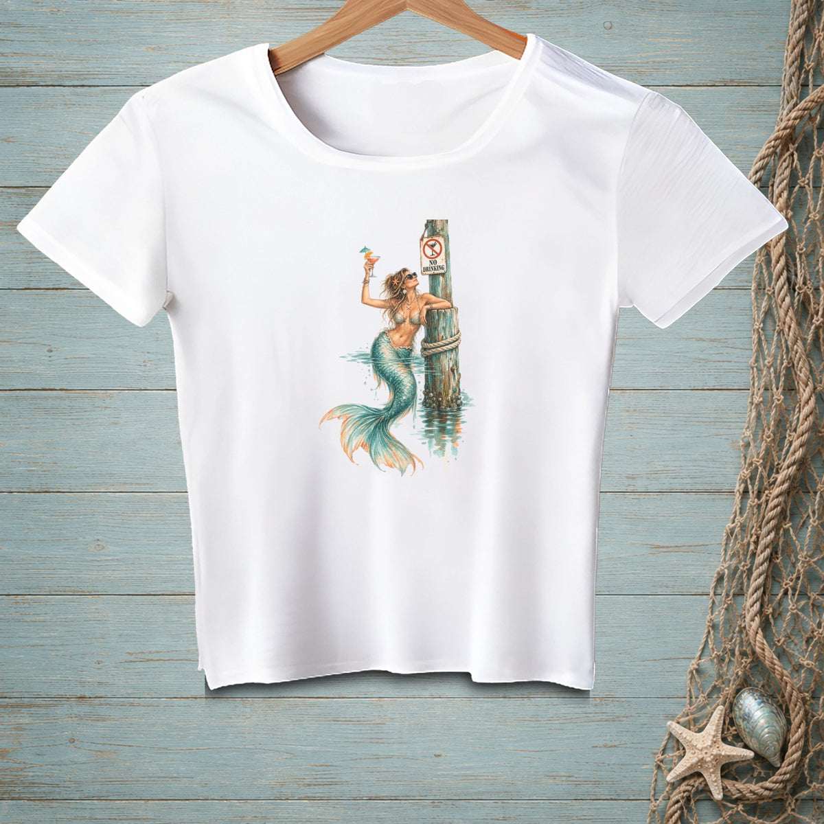 White t-shirt with a mermaid holding a drink next to a "No Drinking" sign.