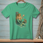 Green t-shirt with mermaid holding seashell and a crab on a rock.