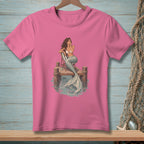Pink t-shirt with illustration of a mermaid sitting on a pier.