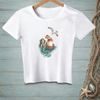 White t-shirt with mermaid, buoy, donut, and seagull graphic.