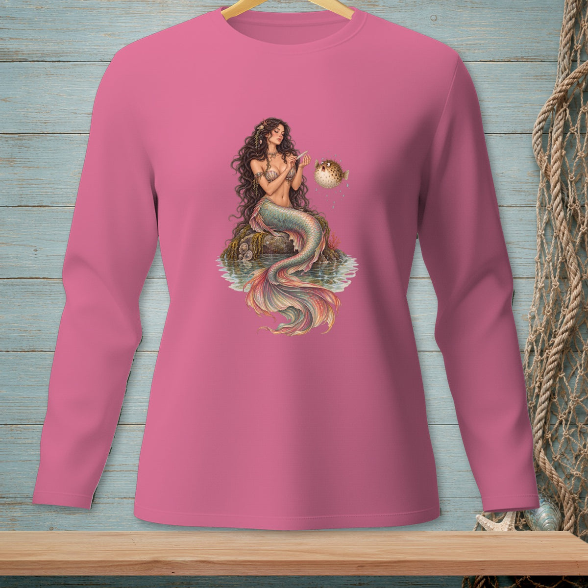 Mermaid sitting on a rock with a pufferfish.