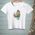White t-shirt with a graphic of a mermaid holding cocktails on a rock with a crab.