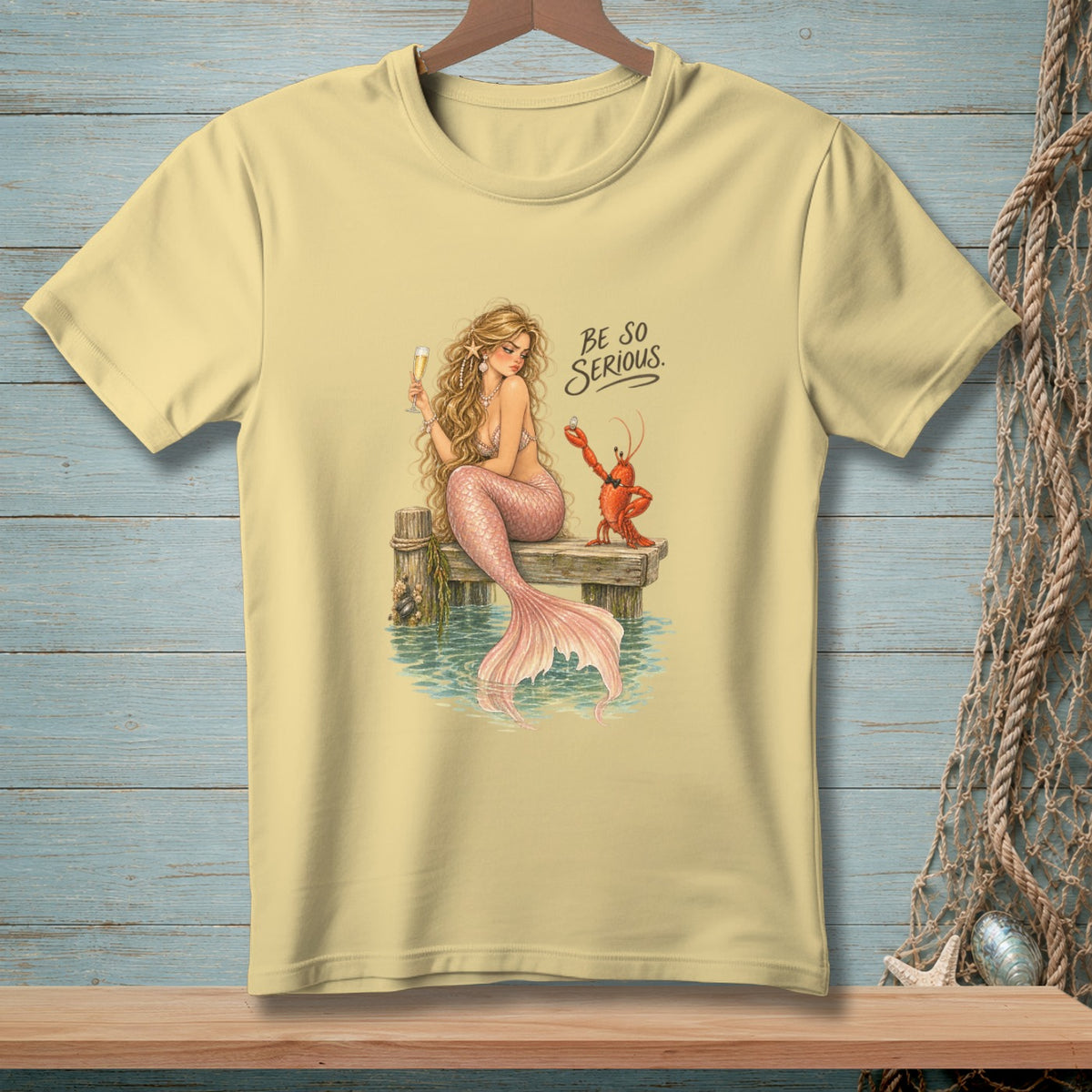 Mermaid holding champagne, lobster offering ring, text "BE SO SERIOUS".