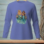 Two mermaids with green tails sitting on a dock, drinking from bottles.