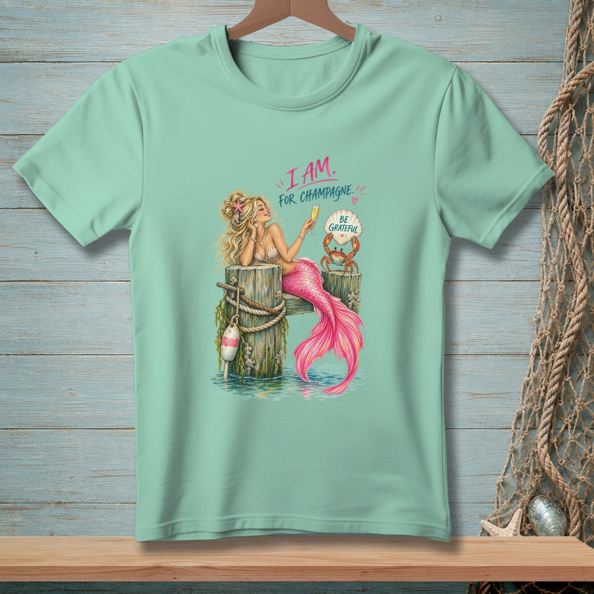 Mermaid with champagne, crab, and text "I AM. FOR CHAMPAGNE. BE GRATEFUL."