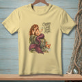 Light yellow t-shirt with a mermaid and crab illustration and "Crabby Looks Good On You" text.
