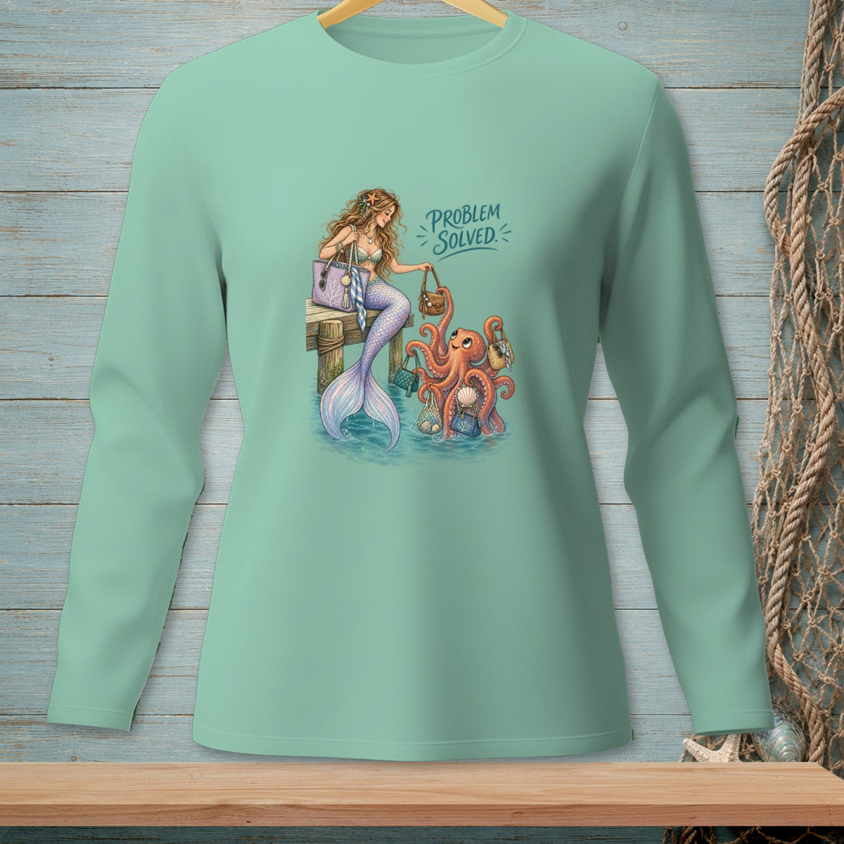 Mermaid and octopus with handbags, text "PROBLEM SOLVED" on mint green shirt.