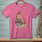 Pink t-shirt with a mermaid sitting on rocks, interacting with a lobster.